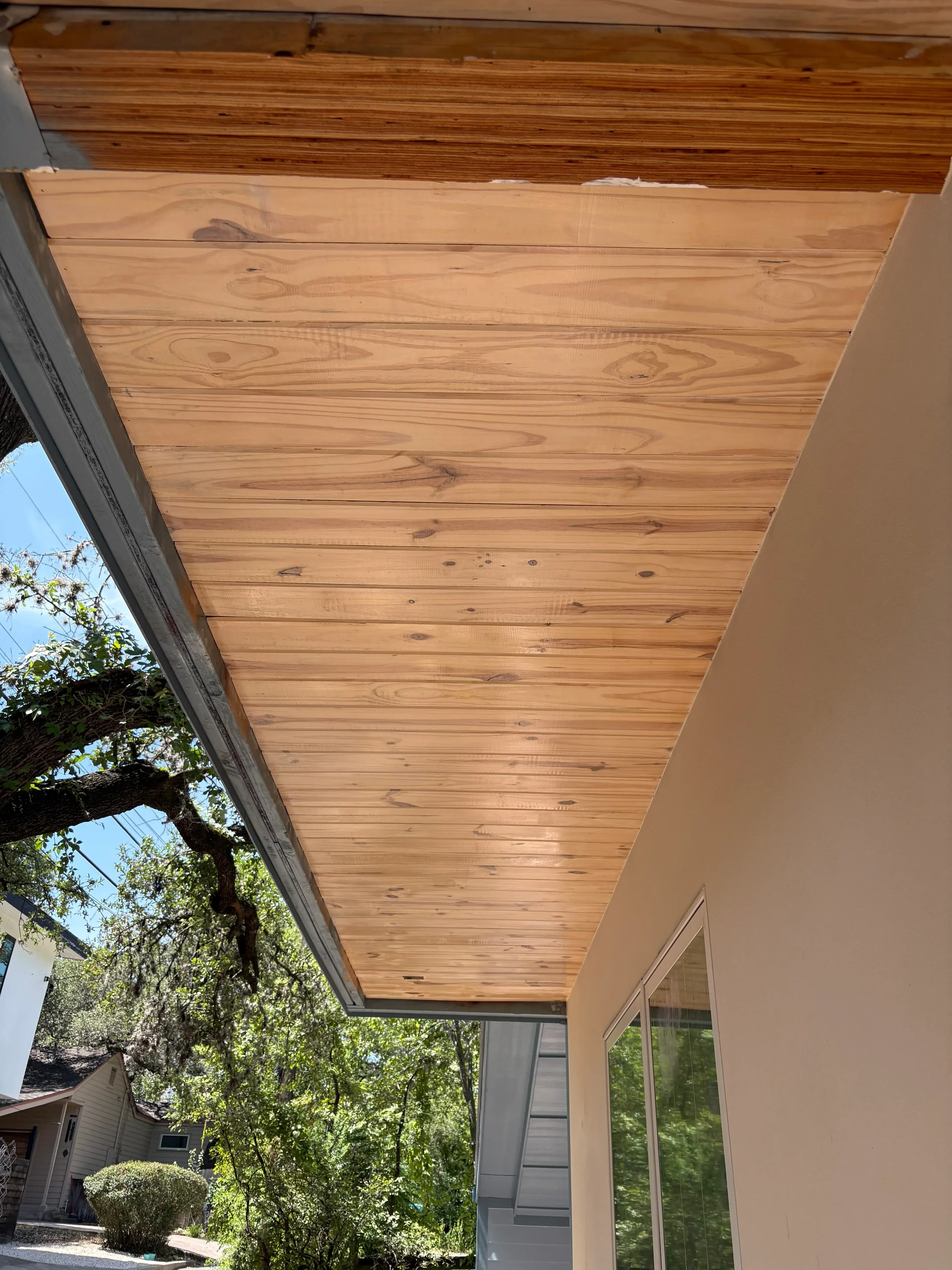 Cedar siding stained with warm honey finish on residential exterior wall